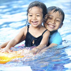 Cute kids playing in a pool