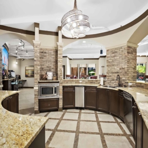 Beautiful kitchen area of resident clubhouse with granite counters and stainless appliances