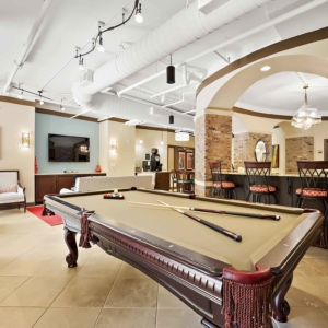 Alternative view of Pool table and kitchen area of resident clubhouse