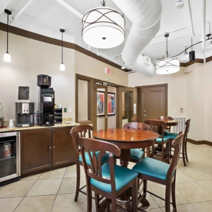 Bistro tables and coffee area in resident clubhouse