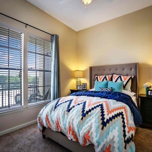Bedroom of model home at Visconti with large windows and lots of natural light