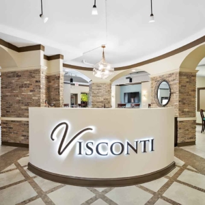 Visconti backlit sign at entrance of clubhouse