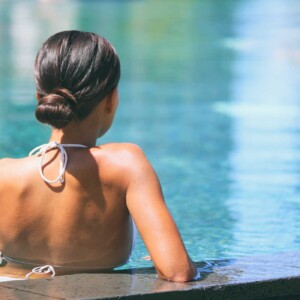 Woman Lounging In Pool